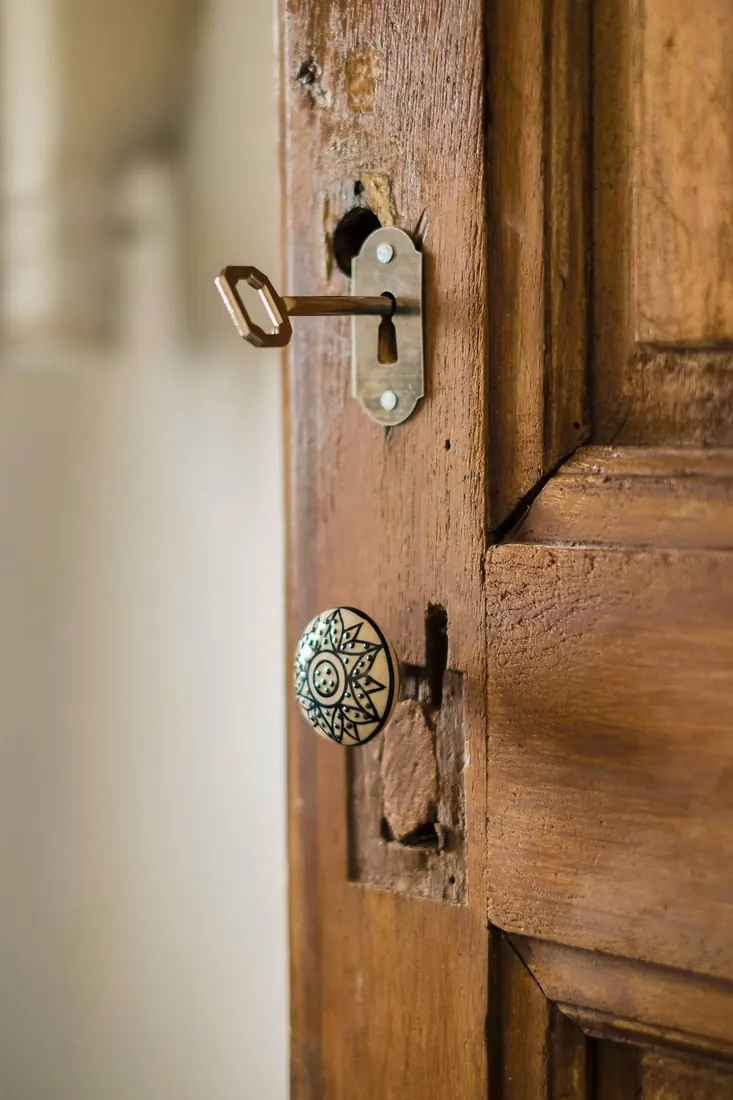 The heavy iron lock on one of the old wooden doors